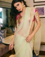 Mesmerizing Actress Mouni Roy in a vibrant fuchsia and cream embroidered lehenga choli with sheer drape photos 10