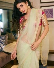 Mesmerizing Actress Mouni Roy in a vibrant fuchsia and cream embroidered lehenga choli with sheer drape photos 10
