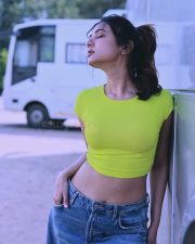 Passionate Actress Sonal Chauhan in a Neon Lime Green Ribbed Crop Top and Blue Denim Jeans Photos 02