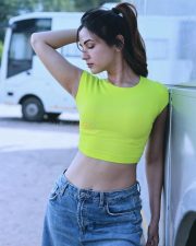 Passionate Actress Sonal Chauhan in a Neon Lime Green Ribbed Crop Top and Blue Denim Jeans Photos 04
