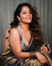 Prema Vimanam Actress Anasuya Bharadwaj in a Blue and Gold Saree with a Matching Embroidered Blouse Photos 01