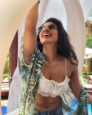 Provocative Shilpa Manjunath in a White Strappy Bikini Crop Top with Mini Denim Shorts Photos 03