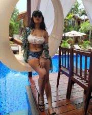 Provocative Shilpa Manjunath in a White Strappy Bikini Crop Top with Mini Denim Shorts Photos 06