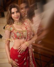 Radiant Actress Nikki Tamboli in a golden embroidered lehenga Photos 03