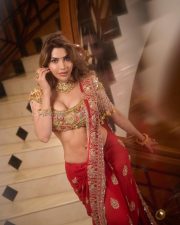 Radiant Actress Nikki Tamboli in a golden embroidered lehenga Photos 04