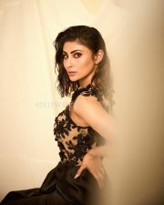 Ravishing Mouni Roy in a Black Thigh Slit Gown with a Netted Black Shirt Photos 01