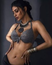 Seductive Mouni Roy Cleavage in a Grey Knot Front Halter Bralette and Black Low Rise Pants Photos 04