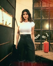 Sexy Beauty Mouni Roy in a White Zara Top and Black Bell Bottom Pant Photos 02