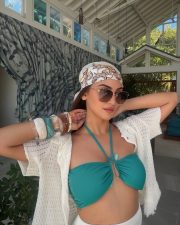 Sexy Krystle Dsouza in a White Mini Skirt and Turquoise Halter Neck Bikini Top Photos 01