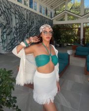 Sexy Krystle Dsouza in a White Mini Skirt and Turquoise Halter Neck Bikini Top Photos 02