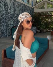 Sexy Krystle Dsouza in a White Mini Skirt and Turquoise Halter Neck Bikini Top Photos 03