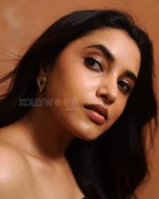 Striking Actress Priyanka Mohan in a Black Strapless Floral Print Dress Photos 01