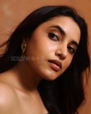 Striking Actress Priyanka Mohan in a Black Strapless Floral Print Dress Photos 01