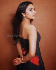 Striking Actress Priyanka Mohan in a Black Strapless Floral Print Dress Photos 02