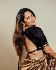 Stunning Anasuya Bharadwaj in a Shimmering Gold Saree with a Black Blouse Pictures 03