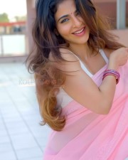 Stunning Iswarya Menon in a Pink Saree with a White Sleeveless Blouse Photos 02