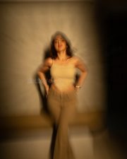 Stunning Mallu Beauty Iswarya Menon in a Beige Ribbed Knit Crop Top and Olive Green Jeans Photos 02