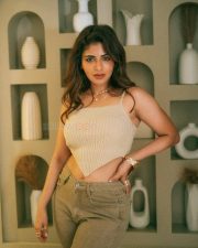 Stunning Mallu Beauty Iswarya Menon in a Beige Ribbed Knit Crop Top and Olive Green Jeans Photos 03
