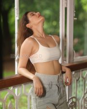 Stylish Actress Amyra Dastur in a White Crop Top Denim Shorts Photos 01
