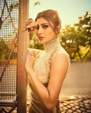 Stylish Mouni Roy in a Golden Yarn Draped Fitted Corset Dress Photos 01