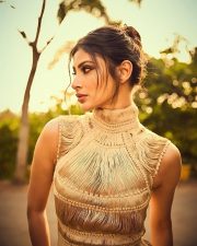 Stylish Mouni Roy in a Golden Yarn Draped Fitted Corset Dress Photos 03