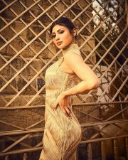 Stylish Mouni Roy in a Golden Yarn Draped Fitted Corset Dress Photos 04