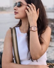 Stylish Priyanka Arul Mohan in a White Sleeveless Top and Blue Denim Photos 02