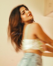 Sultry Iswarya Menon in a Denim Short and Butterfly Crop Top Pictures 03