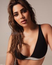Sultry Nikki Tamboli Cleavage in a Black Triangle Bralette Photos 03