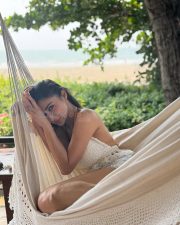The Wives Actress Mouni Roy in a Boho Chic White Halter Style Crochet Bralette Crop Top with a Denim Shorts Photos 03