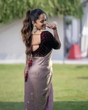 Tollywood Actress Anasuya Bharadwaj in a Muave and Silver Dual Tone Floral Butti Embroidery Saree with a Deep Wine Colored Velvet Blouse Pictures 02