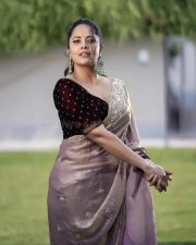 Tollywood Actress Anasuya Bharadwaj in a Muave and Silver Dual Tone Floral Butti Embroidery Saree with a Deep Wine Colored Velvet Blouse Pictures 04