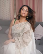 Tollywood Celebrity Anasuya Bharadwaj in an Off White Striped Saree with a Green Sleeveless Strap Blouse Photos 05