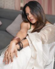 Tollywood Celebrity Anasuya Bharadwaj in an Off White Striped Saree with a Green Sleeveless Strap Blouse Photos 07