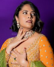 Wolf Actress Anasuya Bharadwaj in a Vibrant Orange Floor Length Anarkali Gown with a Green Organza Dupatta Photos 02