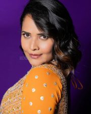 Wolf Actress Anasuya Bharadwaj in a Vibrant Orange Floor Length Anarkali Gown with a Green Organza Dupatta Photos 04