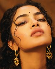 Actress Anupama Parameswaran in a Black Sleeveless Tree of Hearts Top with a Matching Palazzo Pants Photos 02