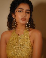 Actress Anupama Parameswaran in a Gold Sequined Halter Neck Top with a Matching Golden Skirt Pictures 01