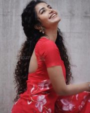 Actress Anupama Parameswaran in a Hibiscus Roses on Red Saree with Matching Red Short Sleeved Blouse Photos 01
