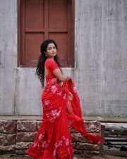 Actress Anupama Parameswaran in a Hibiscus Roses on Red Saree with Matching Red Short Sleeved Blouse Photos 03