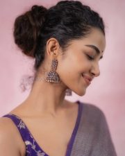Actress Anupama Parameswaran in a Metallic Silver Grey Tissue Saree with a Contrasting Short Sleeveless Purple Blouse Photos 03