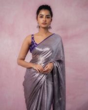Actress Anupama Parameswaran in a Metallic Silver Grey Tissue Saree with a Contrasting Short Sleeveless Purple Blouse Photos 06