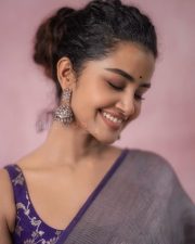 Actress Anupama Parameswaran in a Metallic Silver Grey Tissue Saree with a Contrasting Short Sleeveless Purple Blouse Photos 08