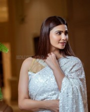 Actress Daisy Shah in a White Saree Photoshoot Pictures 02