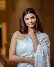 Actress Daisy Shah in a White Saree Photoshoot Pictures 03