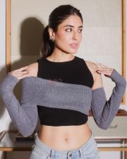 Actress Kritika Kamra in a Black Crop Top with a Grey Knitted Overlay Photos 01