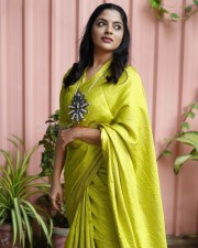 Actress Nikhila Vimal in a Georgette Lime Green Woven Design Saree Photos 01
