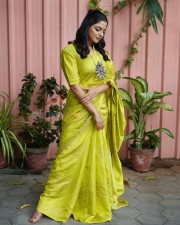 Actress Nikhila Vimal in a Georgette Lime Green Woven Design Saree Photos 02