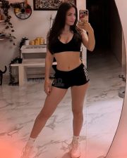 Adorable Elli AvrRam in a Black Sports Bra and Shorts Pictures 01