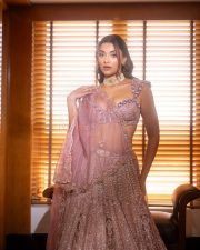 Arjun Son of Vyjayanthi Heroine Saiee Manjrekar in a Purple Embroidered Lehenga Set Photos 01